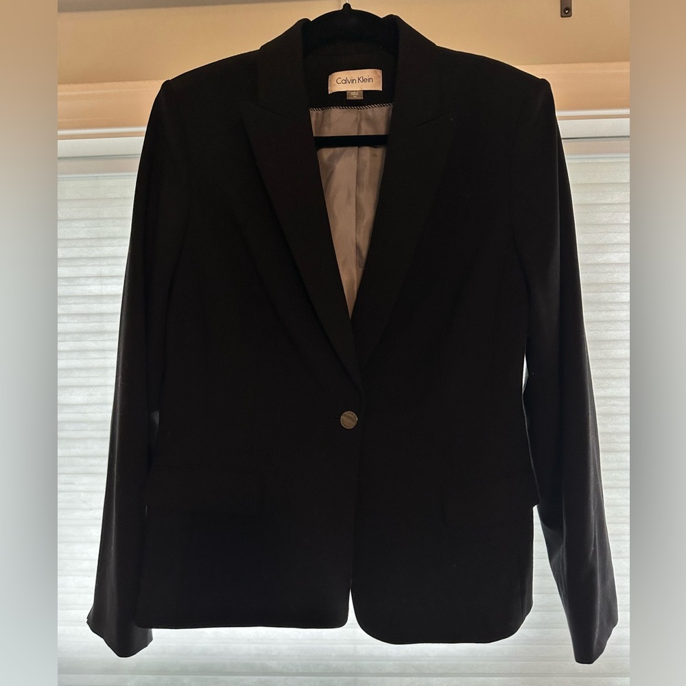 Black Calvin Klein suit jacket; size 12.
